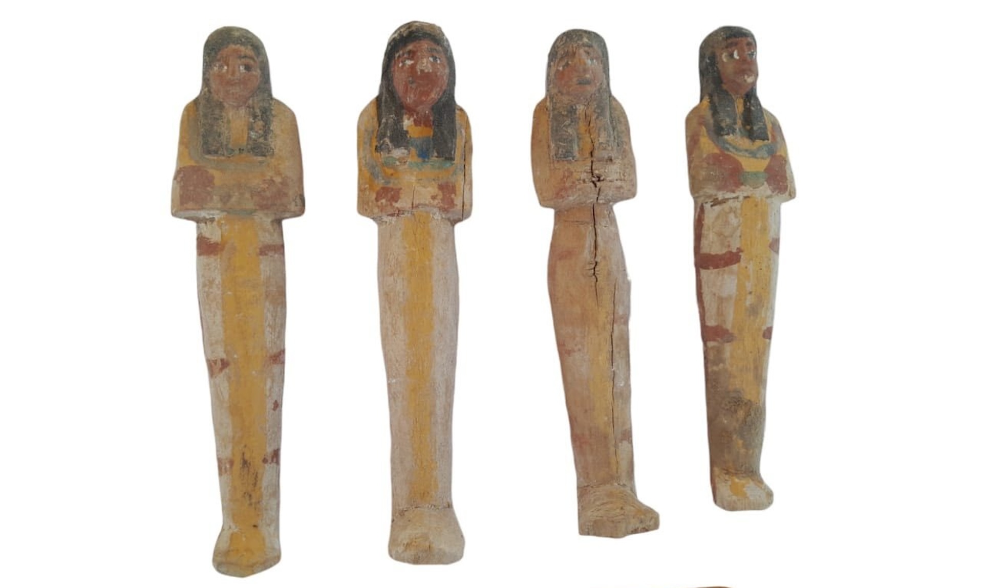 a photo of four Egyptian figurines
