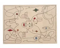 An outdoor rug with a pattern of scribbled lines and illustrations