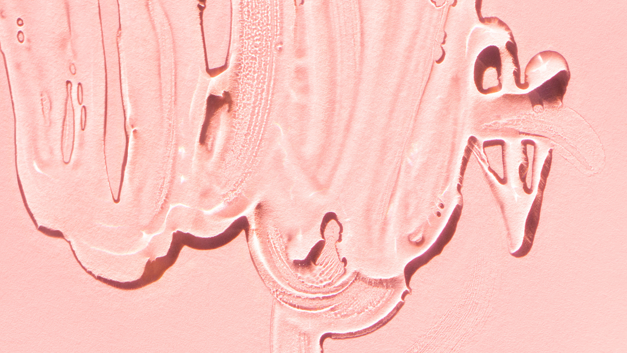 A photo of lube on a pink background