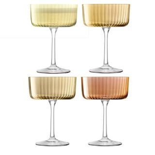 A set of four amber champagne flutes