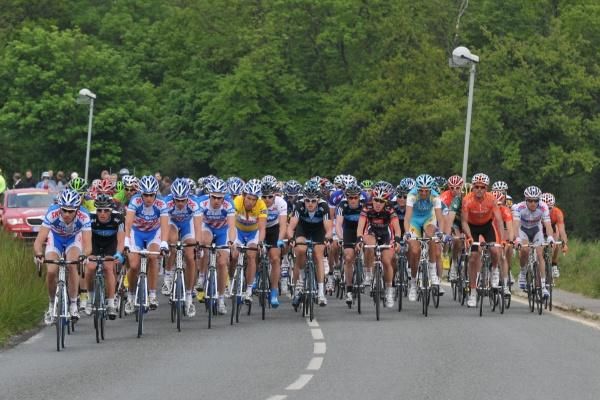 Kenny Van Hummel sits near the front in the leader's yellow jersey.