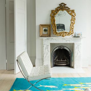 modern white living room with marble fireplace