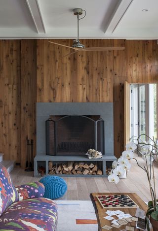 fireplace in timber clad living room