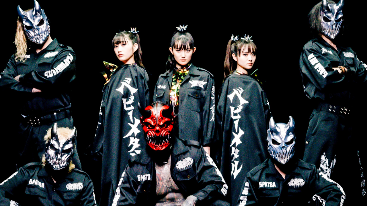 Members of babymetal and Slaughter To Prevail against a black background in 2025