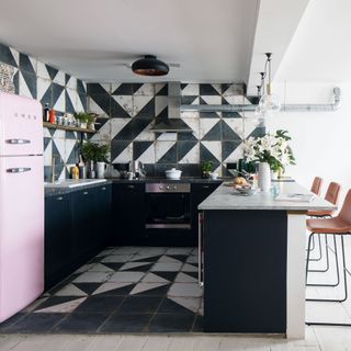 kitchen with black and white colored and chairs