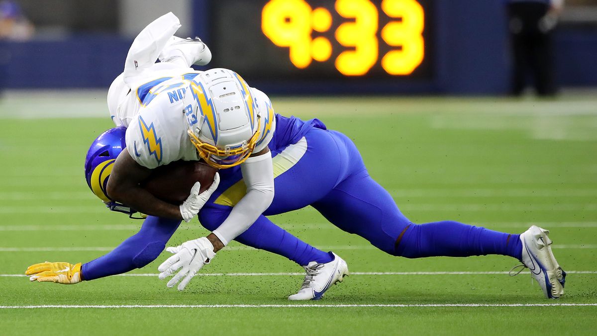 Brontae Harris #35 of the Los Angeles Rams tackles Tyron Johnson #83 of the Los Angeles Chargers during the first quarter during the preseason game at SoFi Stadium on Aug. 14, 2021 in Inglewood, California.