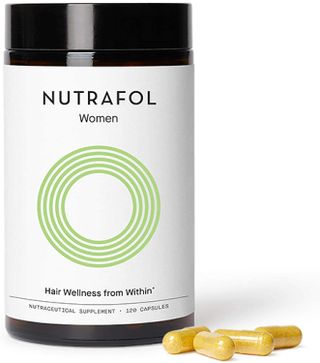 Nutrafol bottle of supplement capsules