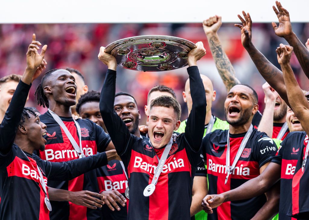 Bayer Leverkusen players celebrate with the Meisterschale