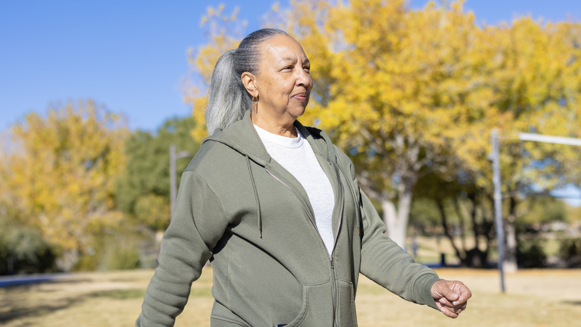 Senior woman walking outside