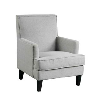 A gray armchair with black legs