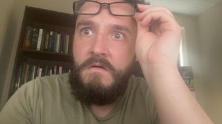 Jacob Fox, raising his glasses and looking at something truly amazing