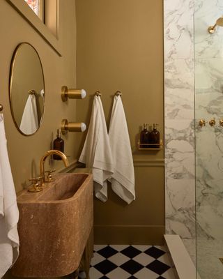 a bathroom with a brown color scheme