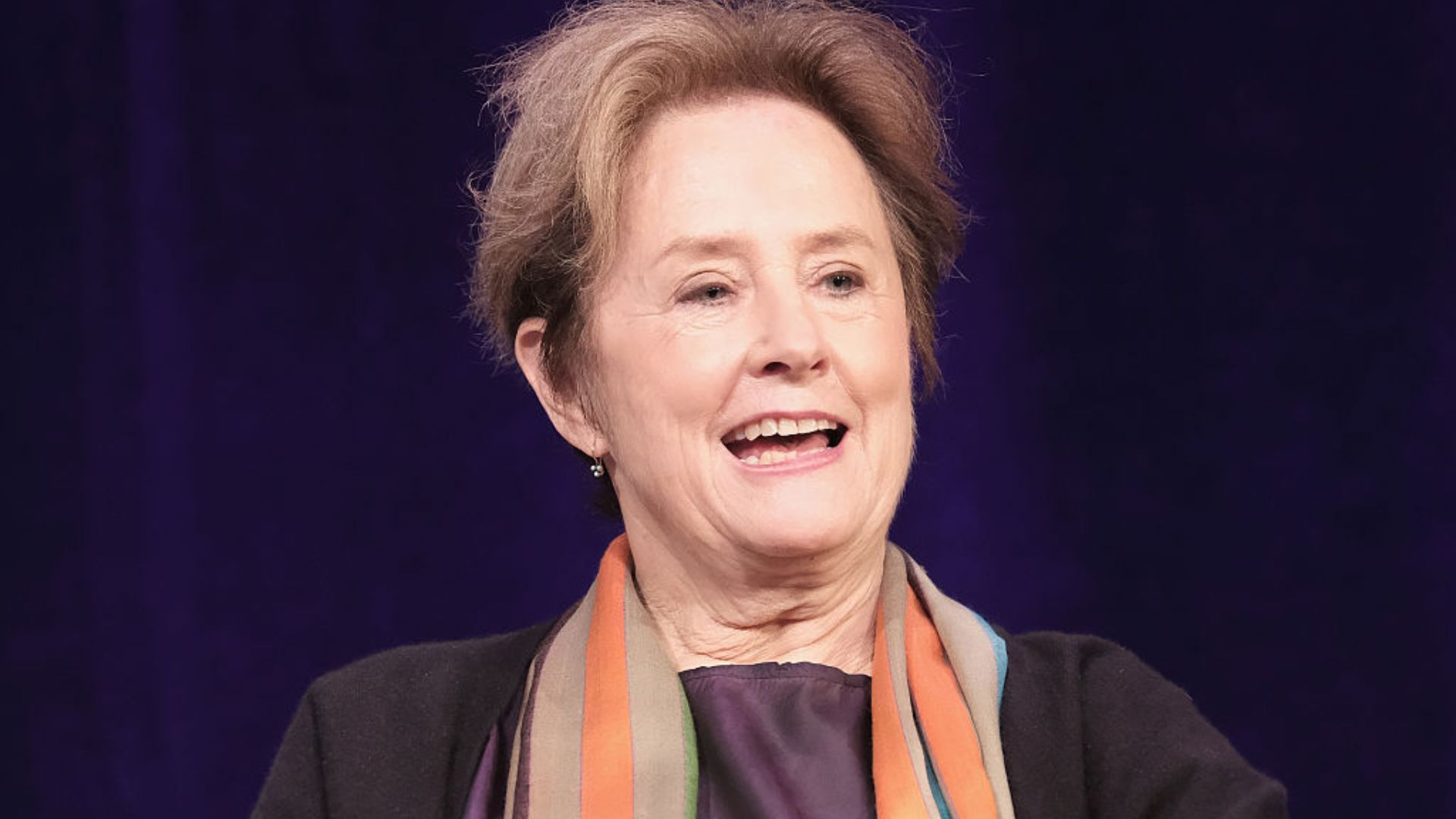 Alice Waters in a orange scarf