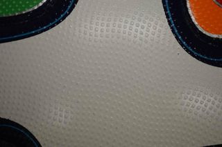 Surface texture on the Brazuca ball. The texture is expected to help in guiding the air flow on the surface when the ball is kicked to long distances, and to keep the trajectory stable.