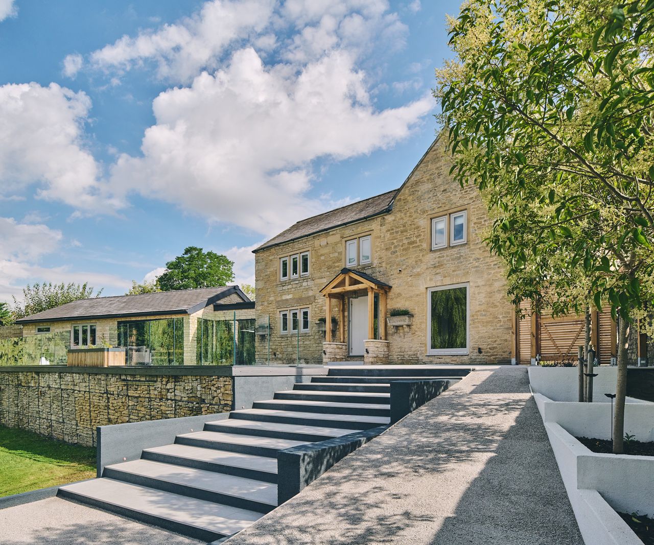View of a refurbished 18th century stone house with an extension