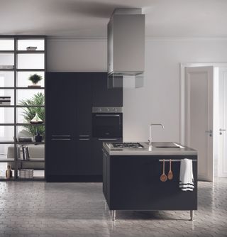 a dark kitchen with a small kitchen island with legs and a sink in a modern style