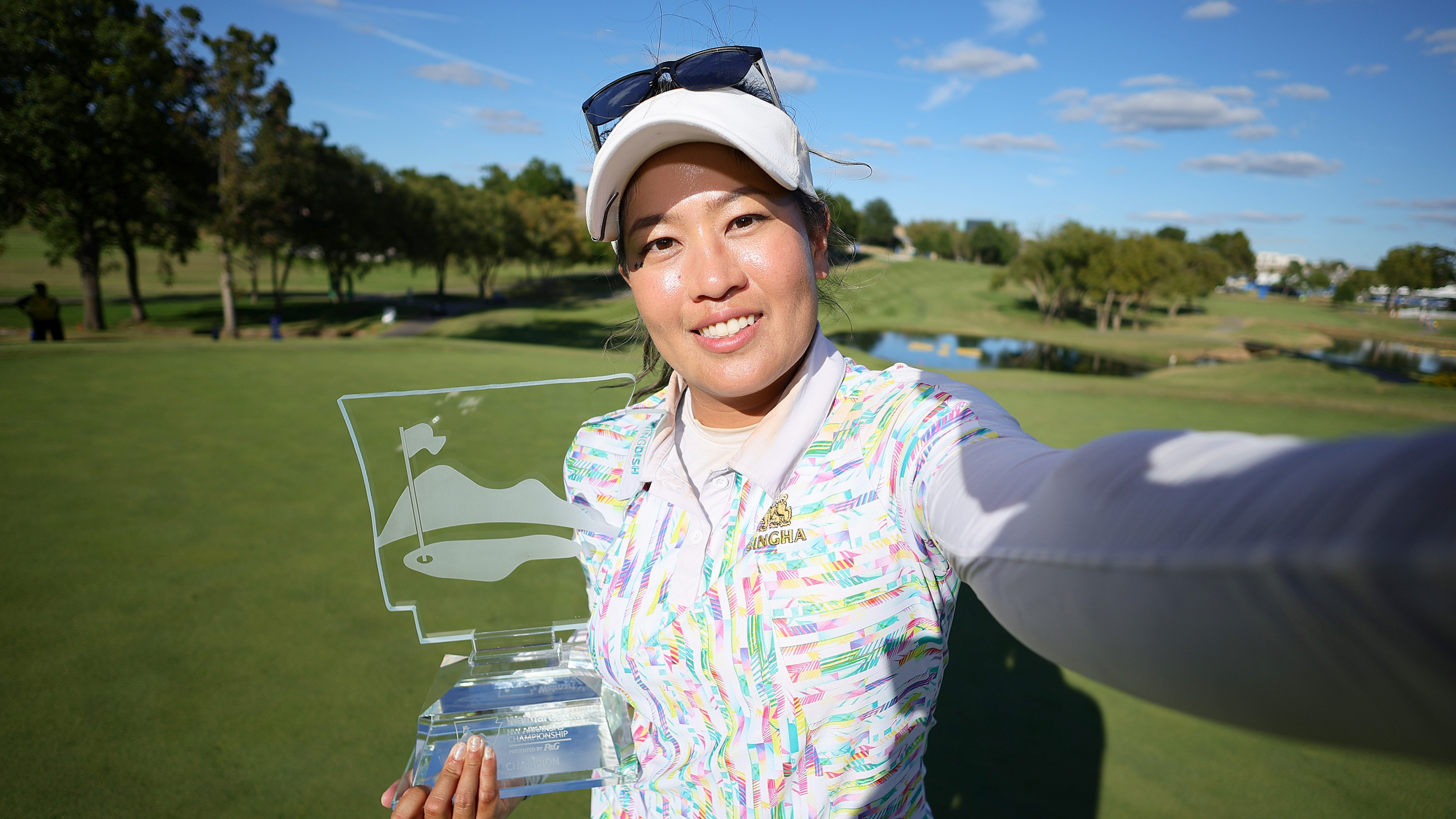 Jasmine Suwannapura takes a selfie with the Walmart NW Arkansas Championship after her playoff win in 2024