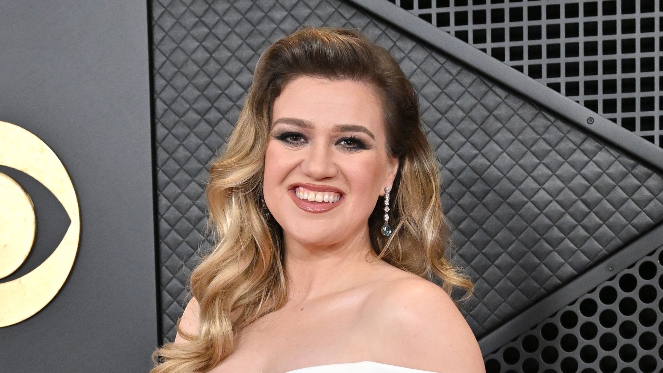 kelly clarkson on a black background
