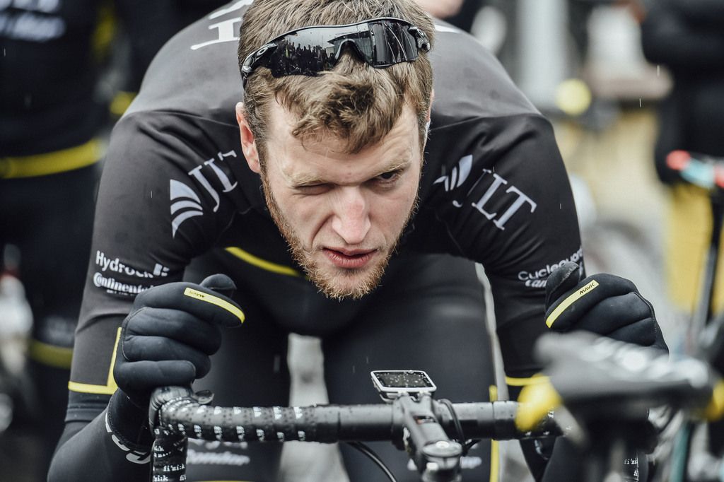 Conor Dunne (JLT Condor) checks his bike over
