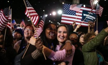 Young Obama supporters in Chicago cheer after networks project the president's re-election.