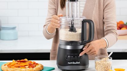 One of the best food processors, the Nutribullet nbp50100 food processor making breadcrumbs on a countertop
