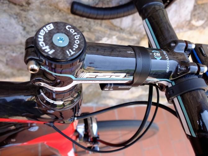 More Bianchi Celeste on the FSA bar and stem and top cap bolt