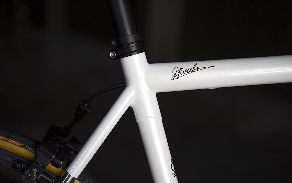 A signature is located on the top tube of the bike