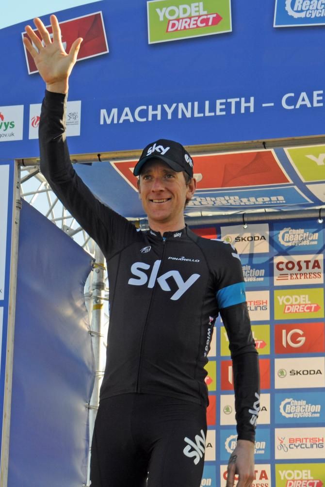 Bradley Wiggins awaits his leader's jersey