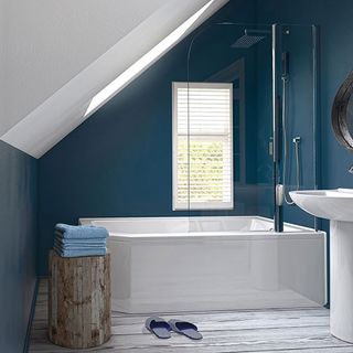 attic bathroom with bathtub