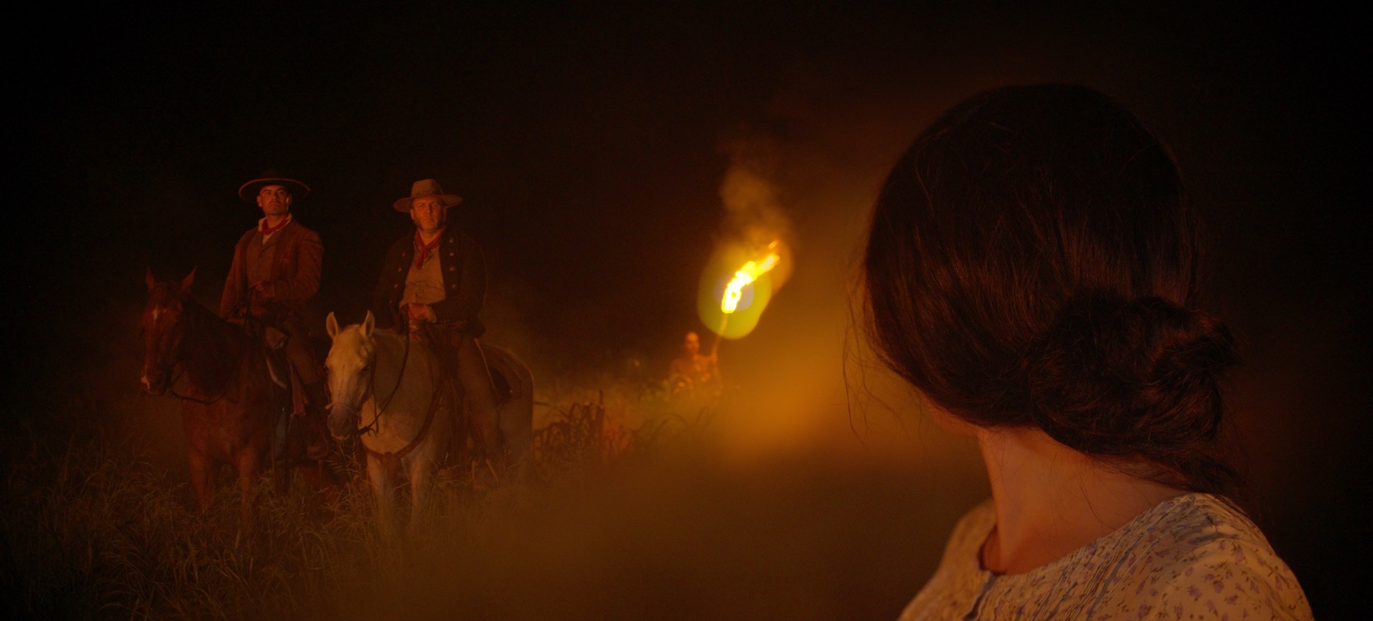 &amp;ldquo;Texas Legacy in Lights,&amp;rdquo; a new live action projection mapping film. Image shows men riding horses at night with a torch towards a woman.