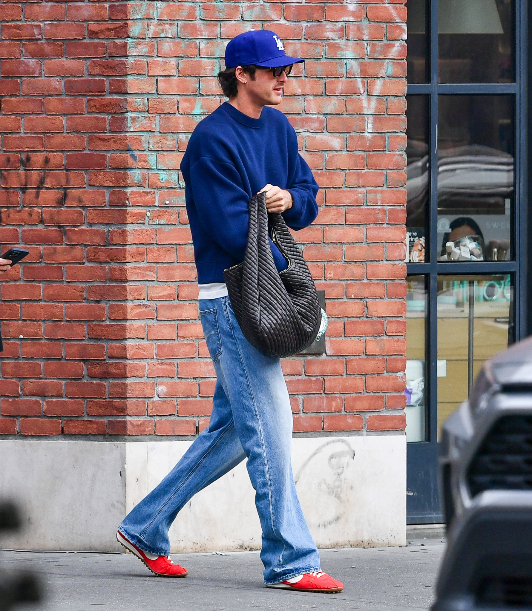 Jacob Elordi was spotted wearing bright red Nike x Jacquemus Moon sneakers and a Bottega Veneta bag
