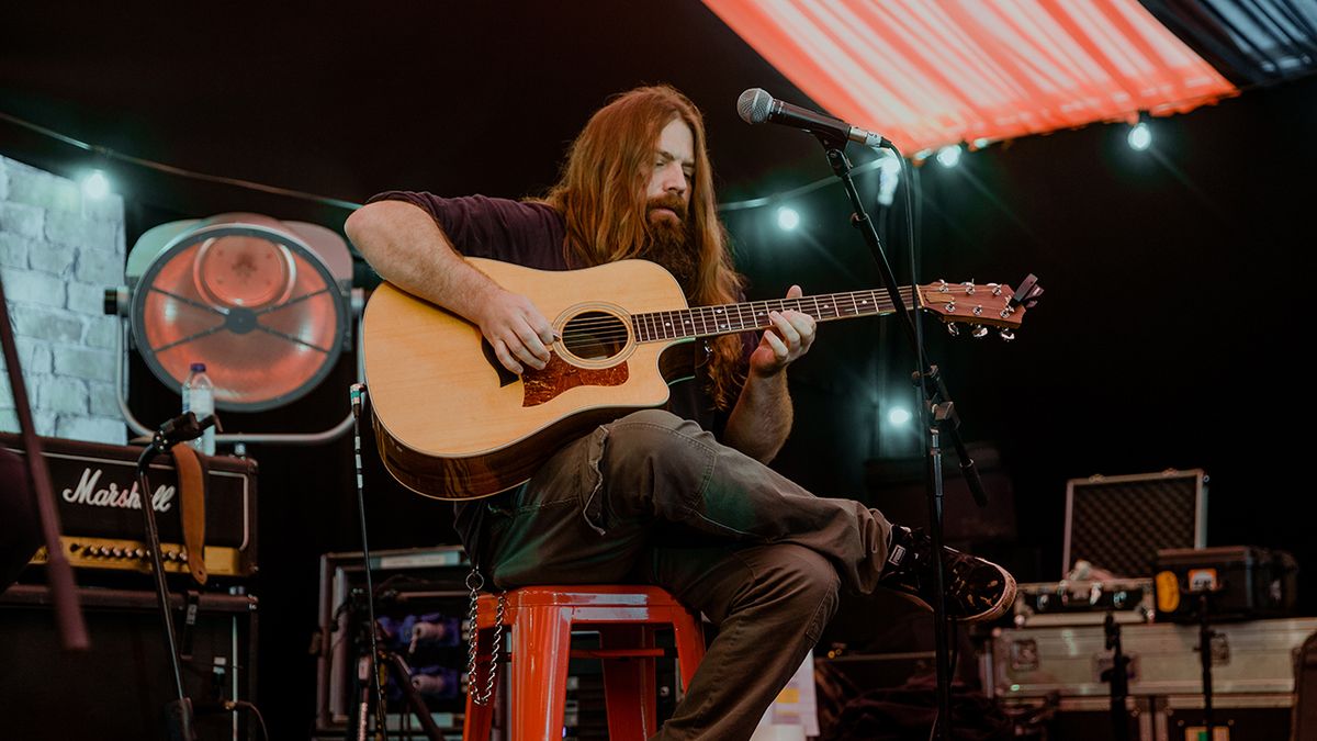 Mark Morton with an acoustic guitar