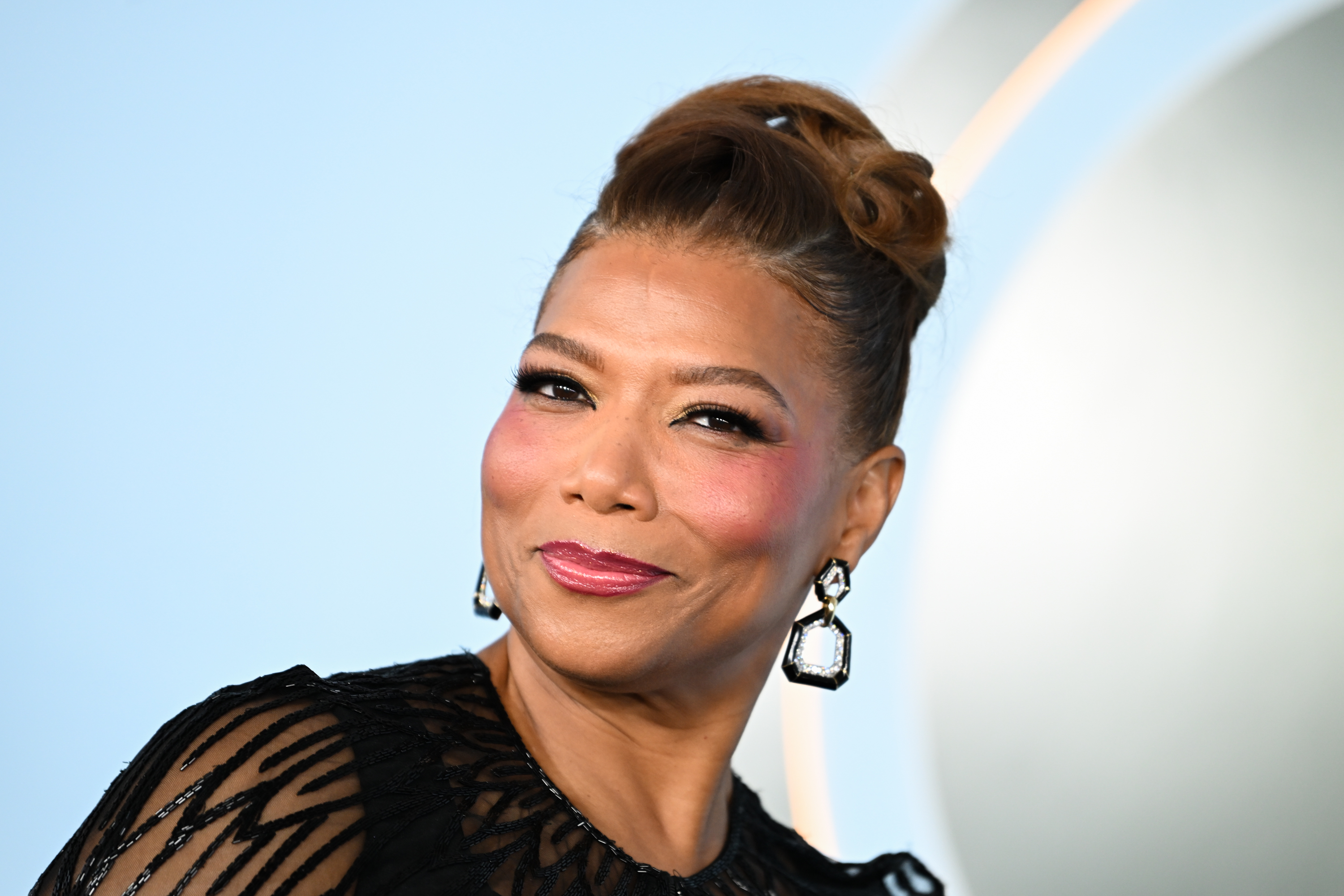 a black woman wearing a black gown and an updo at the 2026 tony awards