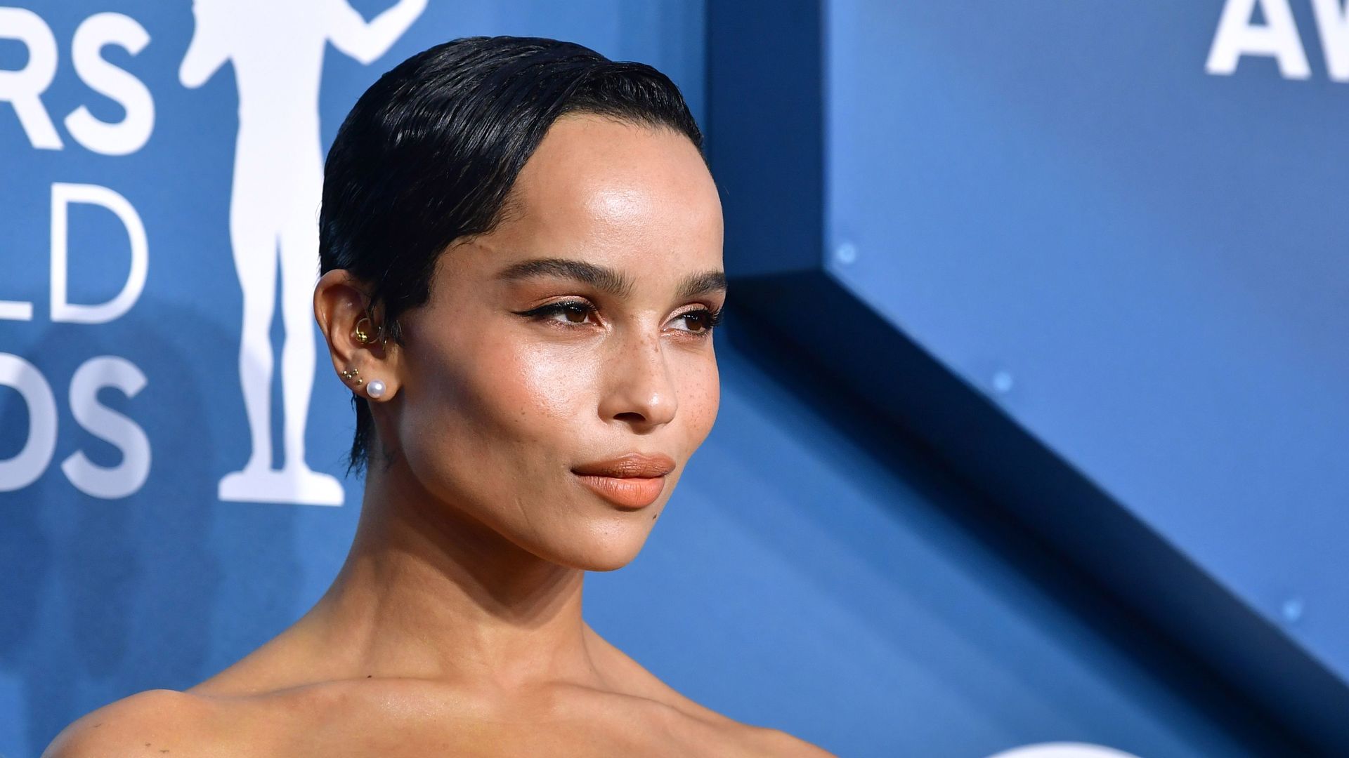 Zoe Kravitz Styled a Band Tee With a Pleated Skirt and Mary-Janes ...