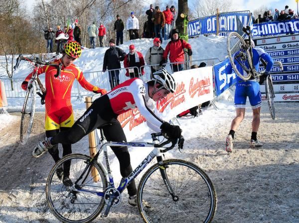Lucas Muller (Switzerland) cant seem to decide whether to run or ride around this corner