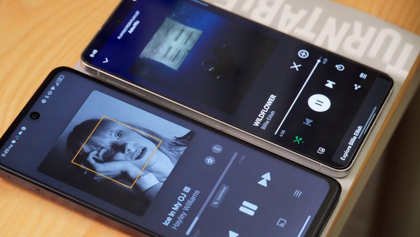 The Apple Music app running on an Android phone compared to another running the Spotify app.