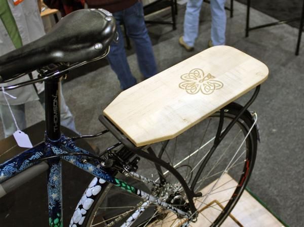 Shamrock Cycles topped the rear rack with this nicely finished wooden shelf.
