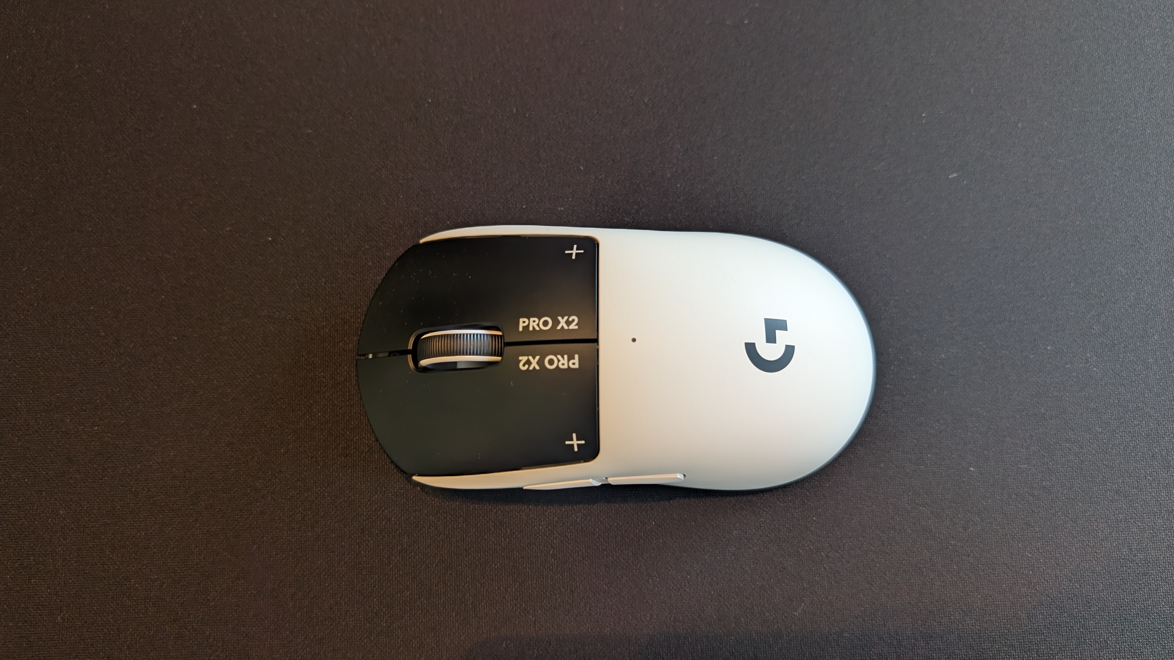 The Logitech G Pro X2 Superstrike pictured on a black mouse mat.