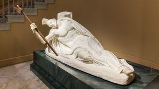 a sculpture of a Tecumseh leader dying