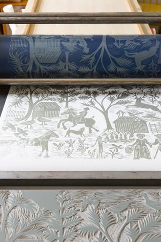 handmade in Britain lino cut wallpaper design on printing press