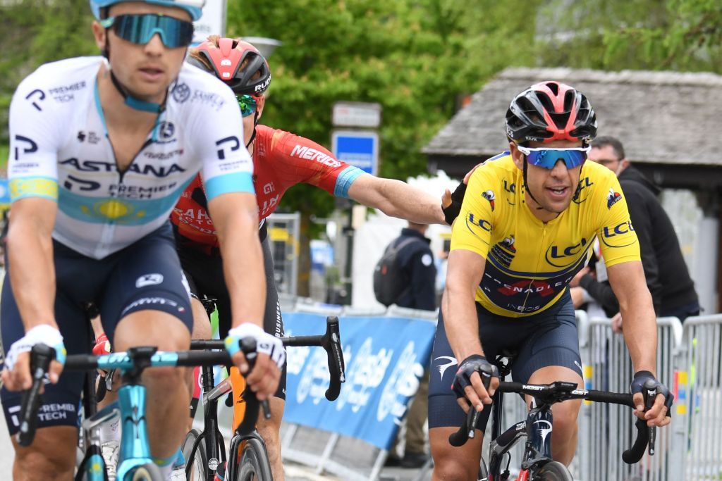 Team Ineos Richie Porte of Australia wearing the overall leaders yellow jersey celebrates as he crosses the finish line of the eighth stage after winning the 73rd edition of the Criterium du Dauphine cycling race a 147km between La LechereLesBains and Les Gets on June 6 2021 Photo by Alain JOCARD AFP Photo by ALAIN JOCARDAFP via Getty Images