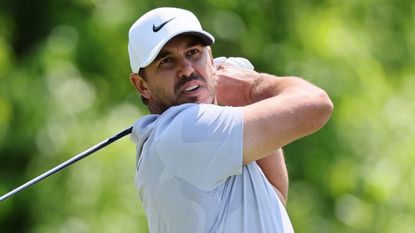 Brooks Koepka takes a shot during the opening round of the 2023 PGA Championship at Oak Hill Country Club