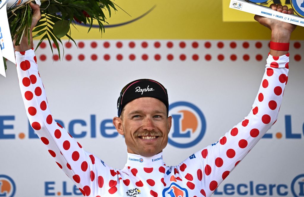 EF EducationEasypost teams Danish rider Magnus Cort Nielsen wearing the climbers dotted jersey celebrates on the podium after the 4th stage of the 109th edition of the Tour de France cycling race 1715 km between Dunkirk and Calais in northern France on July 5 2022 Photo by AnneChristine POUJOULAT AFP Photo by ANNECHRISTINE POUJOULATAFP via Getty Images