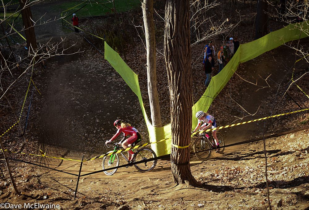 104 Emma White (Cyclocrossworld.com) leading Ellen Noble around a high berm