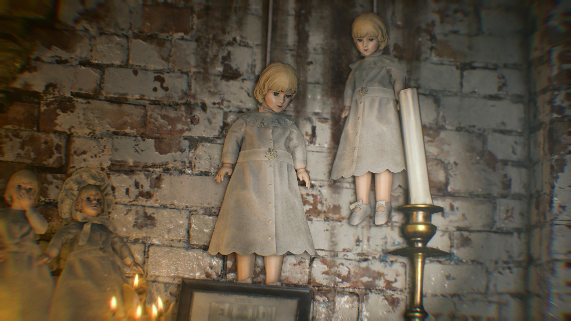 Marie's porcelain dolls lean against a white brick wall