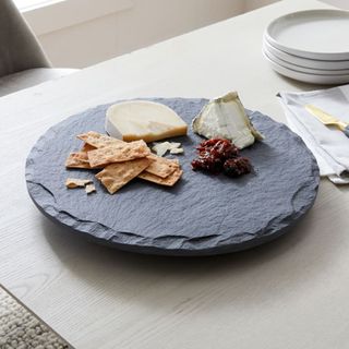 Slate Lazy Susan with assorted cheese and biscuits by West Elm