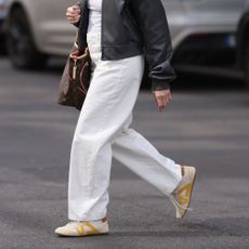 a woman wears Louis Vuitton Sneakerinas