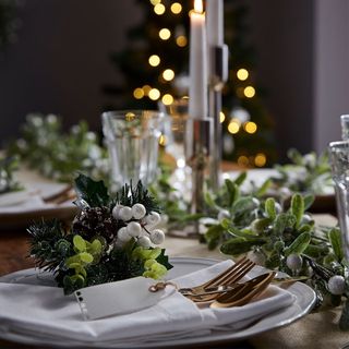 dinning table with white plate and christmas decoration