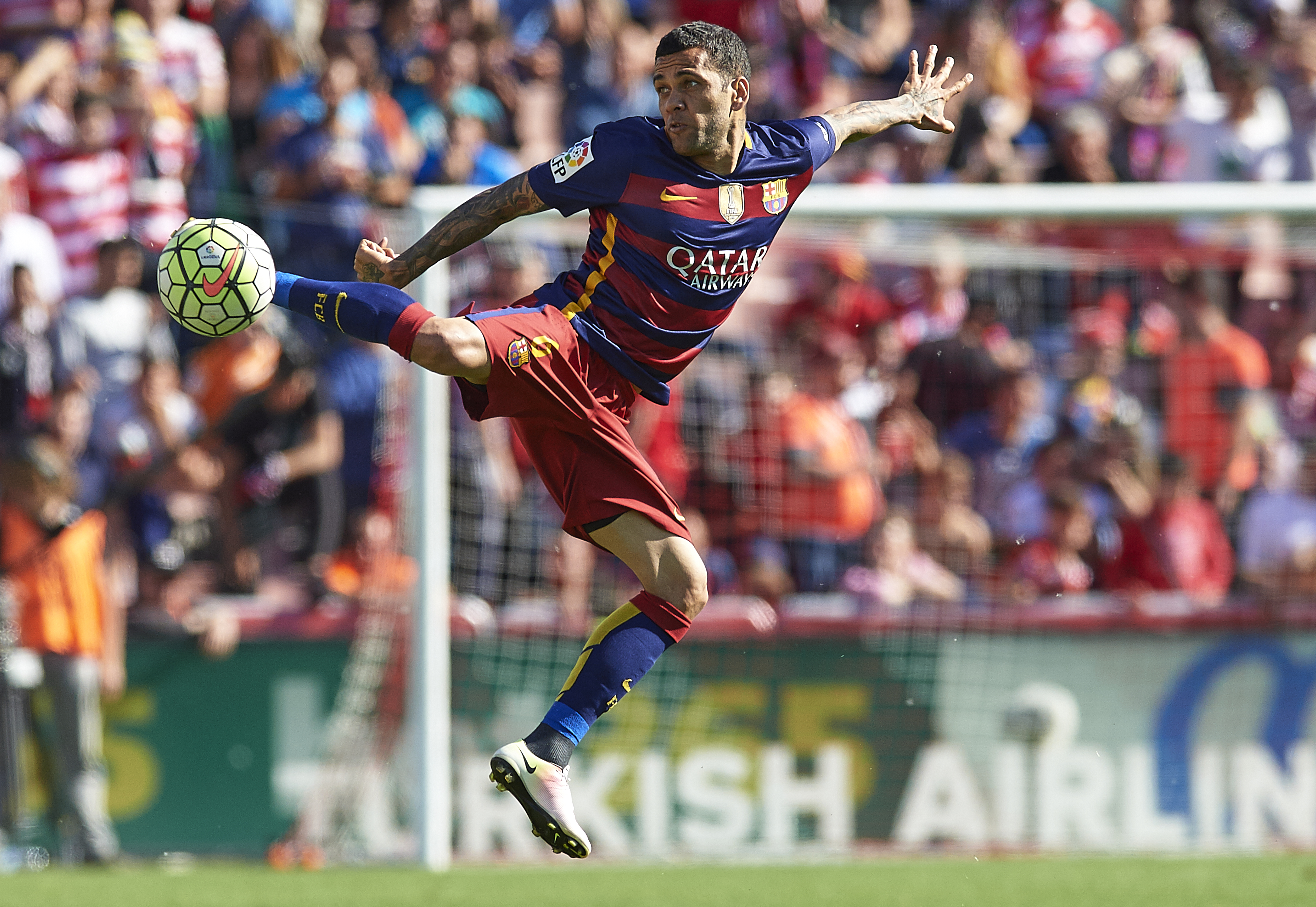 News Dani Alves controls a ball in Barcelona's La Liga sport in opposition to Granada in Might 2016.