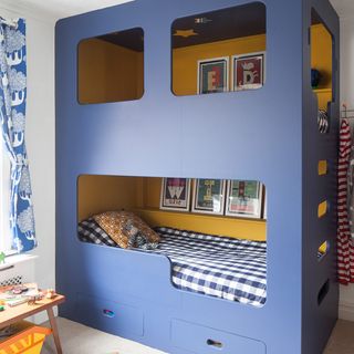 bedroom with blue colour bunk bed and white wall